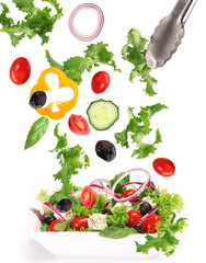 Fresh salad with vegetable in motion.