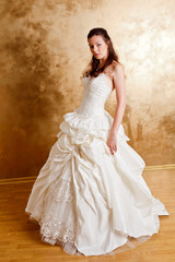 Beautiful dark haired woman in white bridal dress