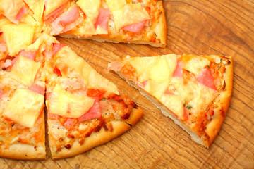 Tasty pizza with ham and cheese.