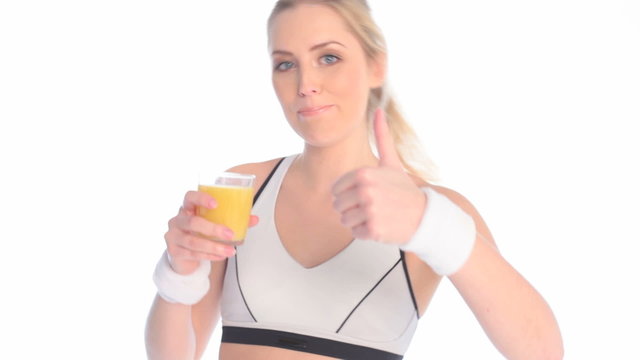Smiling Sportswoman Drinking Fresh Orange Juice