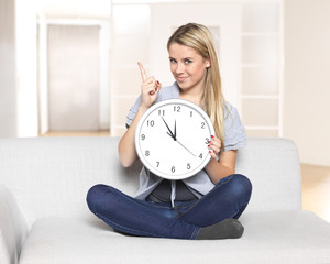 it's 5 before 12 - young woman pointing on clock / time