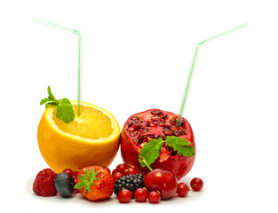 orange and pomegranate with  straw and berries