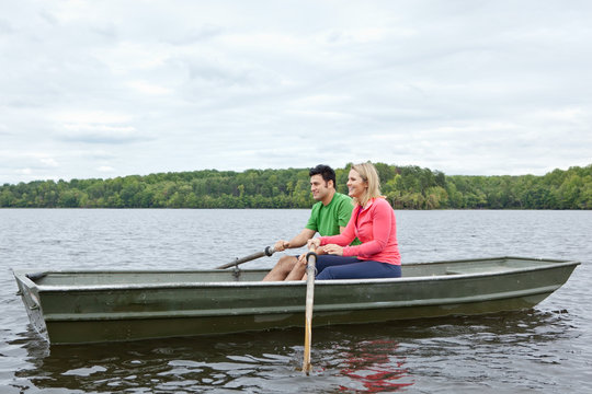 Two people riding a canoe on a lake