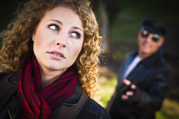 Pretty Young Teen Girl with Man Lurking Behind Her