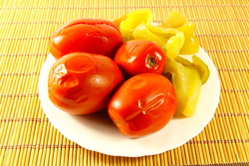 tinned tomatoes with pepper on the table