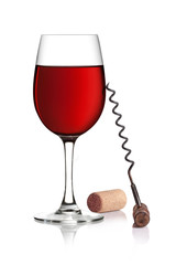 Glass of red wine, corkscrew and cork on a white background