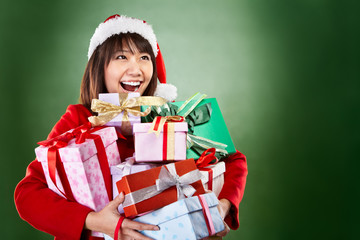 Christmas girl carrying presents