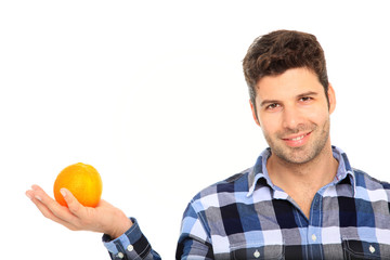 man holding an orange