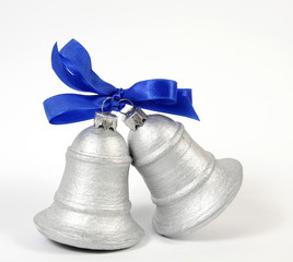 Two silvery bells on the white background