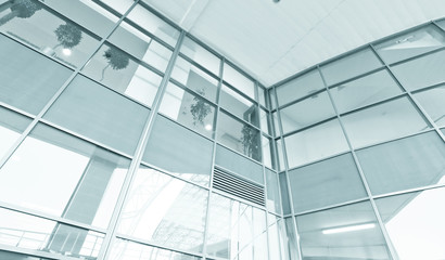 wide glass surface of contemporary angle of business building