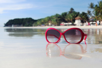 Retro sunglasses on the beach