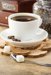 cup of coffee and grinder