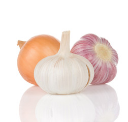 garlics and onion isolated on white