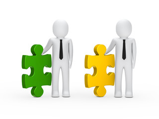 Businessmen hold puzzle