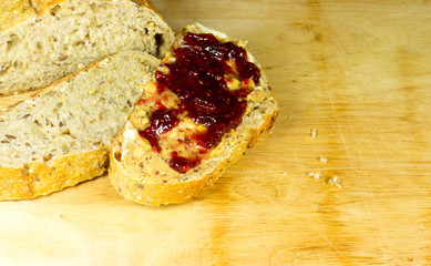 sliced whole grain bread with peanut butter and jelly