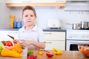 Little boy helping at kitchen