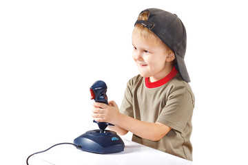 Little boy plays with a joystick on a white background © Boris Bulychev