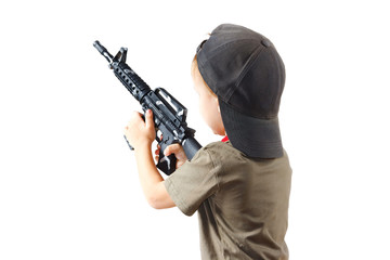 Fototapeta na wymiar Little boy plays with gun on a white background