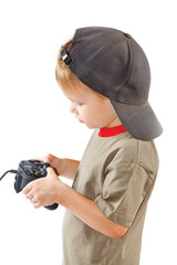 Little boy plays with a joystick on a white background © Boris Bulychev