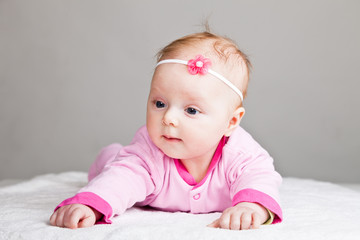 Beautiful infant baby girl in pink