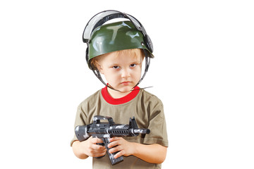 Little boy plays with gun on a white background