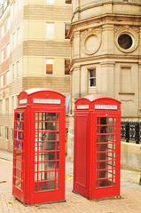 Fototapeta na wymiar Red telephone booths in London