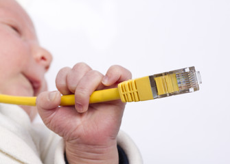 baby holding network cable