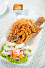 Fried fish on the white plate