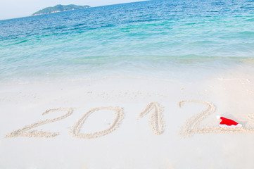 Numbers 2012 on tropical beach sand