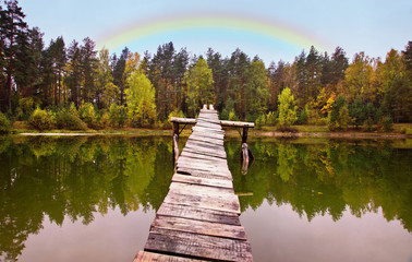 landscape on the wood lake with rainbow