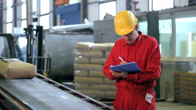 Warehouse Worker in Red Overalls