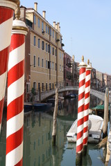 Red and white striped gondola poles (Venice Italy)