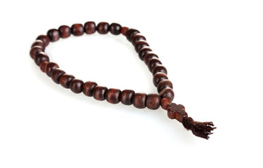 wooden rosary isolated on white