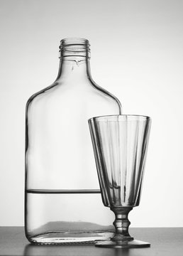 Alcoholism. Bottle with vodka and liquor-glass