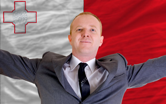 happy businessman because of profitable investment in malta stan