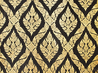 native thai painted pattern of textured wall in ancient buddhist