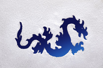 Dragon on a frozen window.