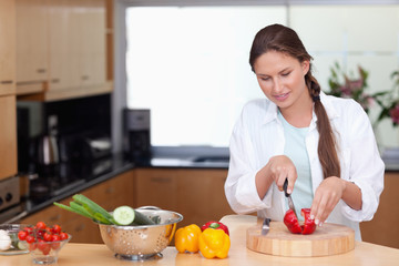 Woman slicing a pepper