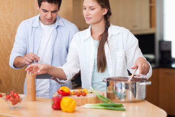 Cute couple using a tablet computer to cook