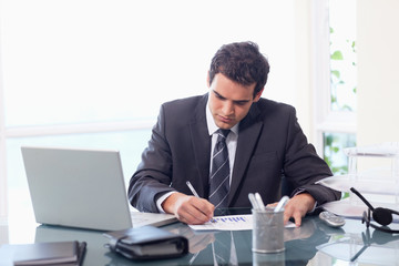 Fototapeta premium Businessman working on statistics