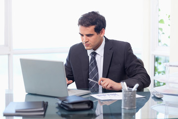 Fototapeta premium Businessman working with a notebook