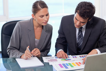 Business team studying statistics
