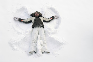 Fototapeta na wymiar girl having fun in the snow