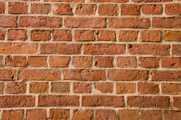 Wall built of clay brick architectural fragment.