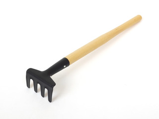 Garden rake is isolated on a white background