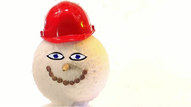 winking snowman with red helmet