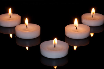 Candle light isolated against dark background