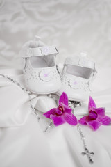 Baby shoes isolated against light background