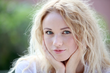 Portrait of beautiful blond smiling woman