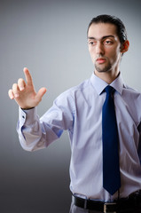 Businessman pressing virtual buttons